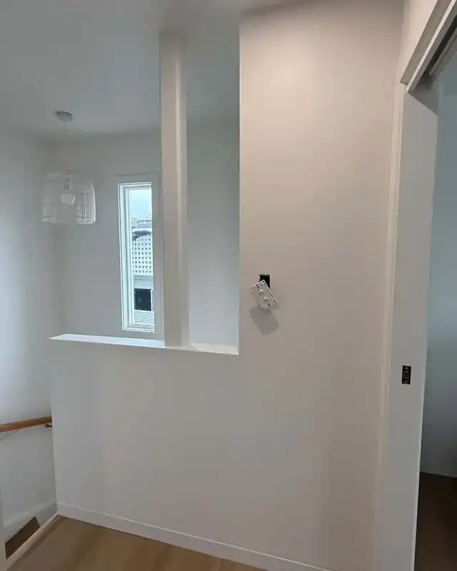Stairwell plaster repair and repaint, after